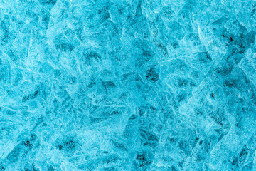 Ice crystals in the form of a blue background. Place for text.