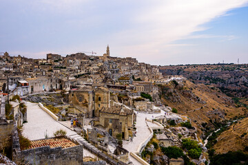 Naklejka na ściany i meble Matera is a city in Italy. The Sassi di Matera, is a complex of cave dwellings carved into the ancient river canyon, often cited as 