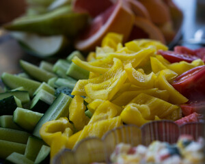 Sliced yellow and red peppers, cucumbers, grapefruit