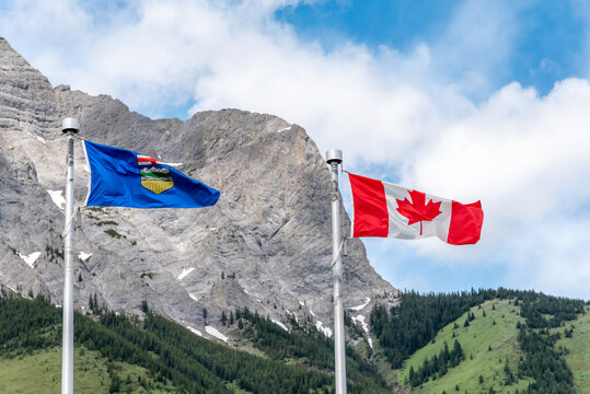 Canadian and Alberta flags waiving on a beautiful summer day in Kananaskis. 