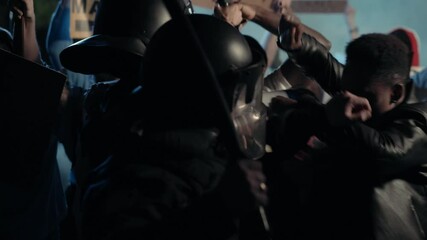 Black Multi-ethnic Men Activists Fighting with the Brutal American Police Officers on Public Rebellion. Street rally. Demonstration. Antiracism. Black Lives Matter. - Powered by Adobe