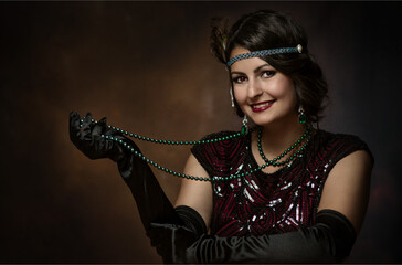 Young elegant woman with pearl necklace in the 1920s