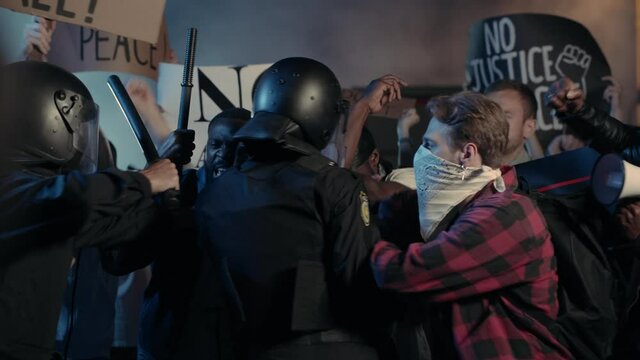 Crowd of Multi-ethnic Furious Strong Men Fighting with Brutal Police Protesting for Human Rights on Street Demstration. Black Lives Matter. Stop Racism.