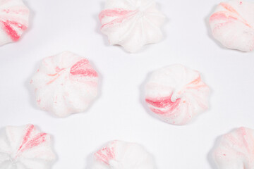 A variety of candies on a white background.