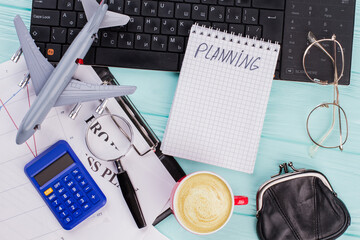 Flat lay composition with keyboard, coffee and other office related objects on blue background....