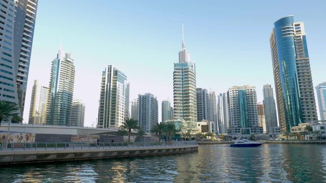 Dubai Marina Walk, slow motion shot of the waterfront location and skyline