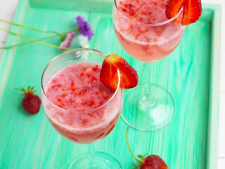 Strawberry lemonade on a tray, picnic concert.