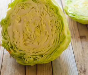 On the table is a white cabbage close-up