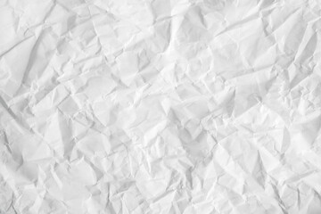 Crumpled white paper texture as a background image. Paper for design with copy space for text or image. Top view. Copy, empty space for text