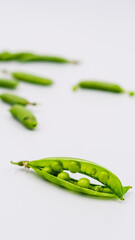 fresh green peas on white background
