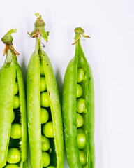fresh green peas on white background