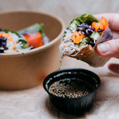 fresh spring rolls with shrimp, vegetables and greens with soy sauce 