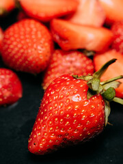 fresh strawberries on a dark table 