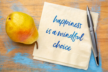 happiness is a mindful choice inspirational note - handwriting on a napkin with a pear fruit, mindfulness concept
