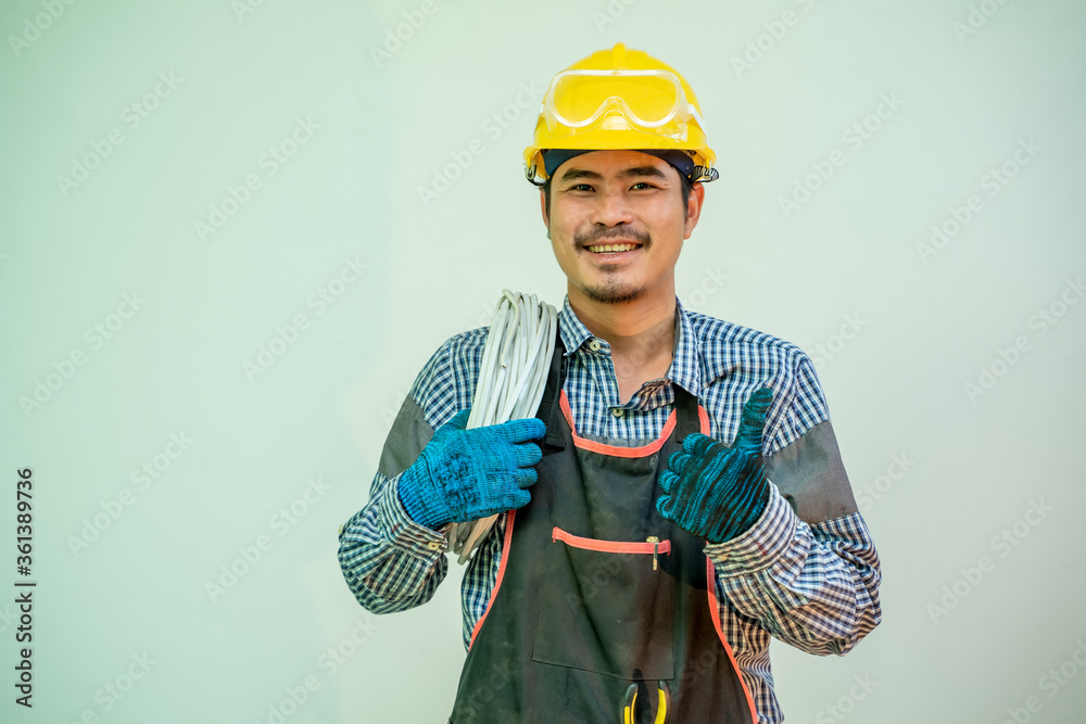 Poster electrician,smiling electrician in helmet and safety with cabling and tools on white background.