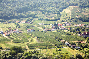 Fototapeta na wymiar picturesque European town far away. Scenic mountain landscape with small old beautiful village. Danube Valley of the Wachau, Austria.