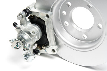 brand new brake discs, brake caliper and brake pad set for car. isolated on white with copy space.