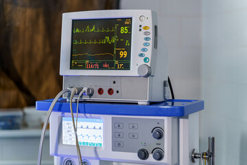 Monitor with results on it. Diagnosing patient. Lungs ventillation equipment.