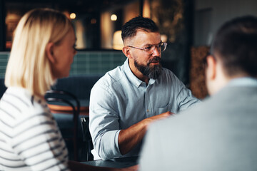 Businessman talking with colleagues