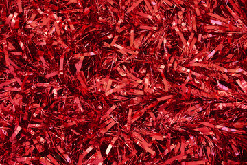 red christmas tinsel as background