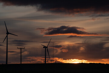 wind turbines at sunset