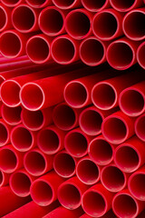 Red plastic pipes in graphic pattern