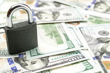 Save money concept. Washington American cash with padlock isolated on white. Usd money background.