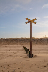 Wooden groyne on the beach