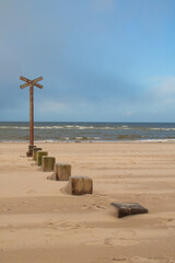 Wooden groyne on the beach