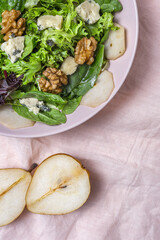 Homemade lettuce assortment salad with blue cheese, walnuts and pear
