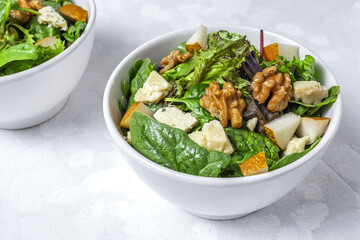 Homemade lettuce assortment salad with blue cheese, walnuts and pear