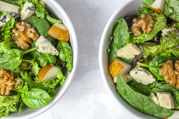 Homemade lettuce assortment salad with blue cheese, walnuts and pear