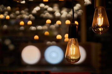 Edison loft style lamp with bokeh light background. Edison lamp, closeup photo. Edison lamp on...