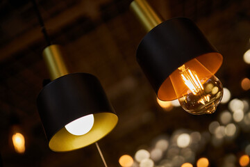 Edison loft style lamp with bokeh light background. Edison lamp, closeup photo. Edison lamp on...