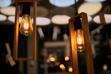 Edison loft style lamp with bokeh light background. Edison lamp, closeup photo. Edison lamp on...