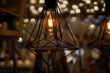 Edison loft style lamp with bokeh light background. Edison lamp, closeup photo. Edison lamp on...