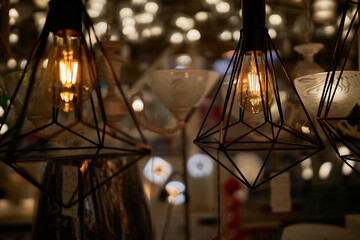Edison loft style lamp with bokeh light background. Edison lamp, closeup photo. Edison lamp on...