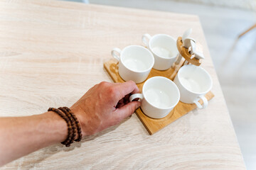 white tea set is in the kitchen, kitchen utensils, four cups