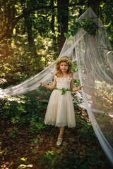 Fototapeta premium little girl in the woods
