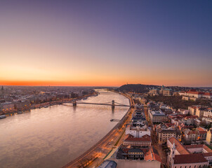 Aerial drone shot of Buda Hill by Danube river with chain bridge before Budapest sunrise
