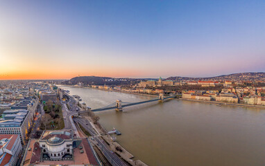 Aerial drone shot of chain bridge over danube river Buda castle before Budapest sunrise