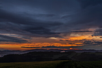 Obraz premium Sunset in hot summer rainy evening near Roprachtice village