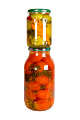Canned vegetables in glass jars isolated on white background