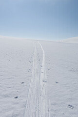skii tracks in snow on mountain