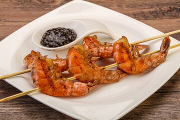 Grilled prawn skewer with pepper sauce