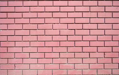 Fuchsia brick wall texture background material construction. Wall made of smooth pink decorative brick. Pattern for designers.