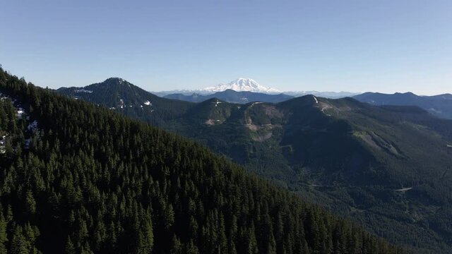 Parallax Mountain Ridge Aerial with Mt Rainier Behind Forest Trees