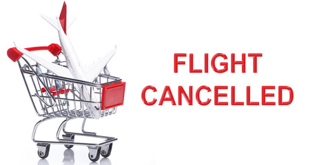 Airplane in a shopping trolley with a message - FLIGHT CANCELLED.
