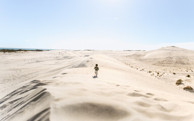 Fototapeta na wymiar kids walking in Lancelin Sand Dunes, Western Australia