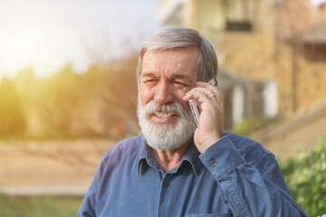 Portrait of a seniıor man talking on the phone. 